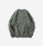 Black distressed sweater by 2KWRLD featuring a relaxed fit and ripped details, shown on a mannequin.