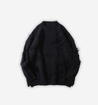 Black distressed sweater by 2KWRLD featuring a relaxed fit with frayed edges and a worn-in look, casual and stylish for everyday wear.