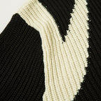 Black cardigan jacket by 2KWRLD, featuring a cozy knit design and front button closure, displayed on a plain background.