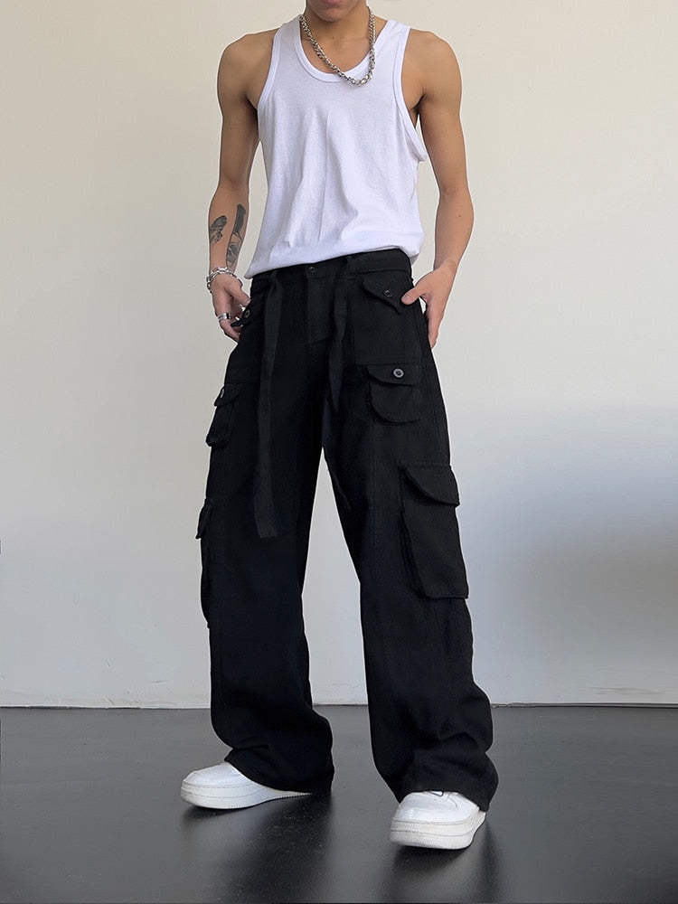 Black loose cargo pants from 2KWRLD featuring relaxed fit, multiple pockets, and casual style.