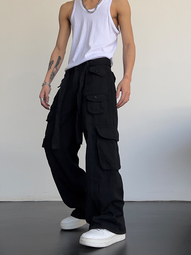 Black loose cargo pants by 2KWRLD featuring a relaxed fit and multiple pockets for casual, streetwear style.