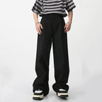 Black loose suit pants from 2KWRLD with a relaxed fit and tailored design, shown on a plain background.