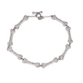 Black bone chain necklace by 2KWRLD featuring a sleek, modern design with detailed bone-shaped links.