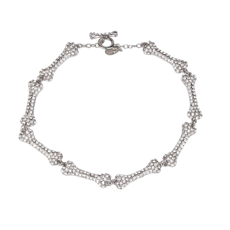 Black bone chain necklace by 2KWRLD featuring a sleek, modern design with detailed bone-shaped links.