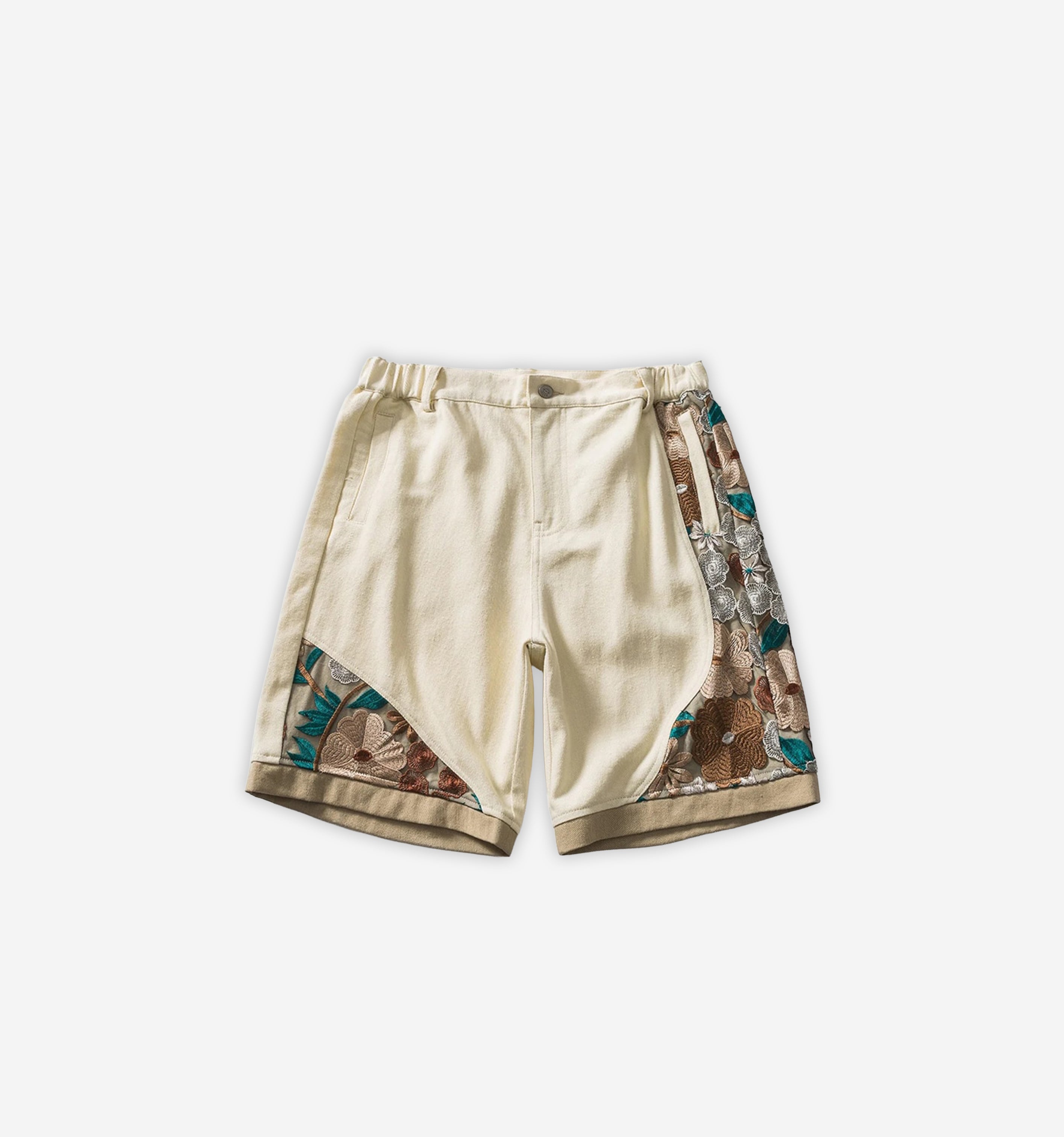 Colorful patchwork shorts from 2KWRLD featuring mixed fabric patterns and a relaxed fit, perfect for casual summer wear.