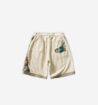 Colorful patchwork shorts by 2KWRLD featuring mixed fabric patterns and a relaxed fit, perfect for casual summer wear.