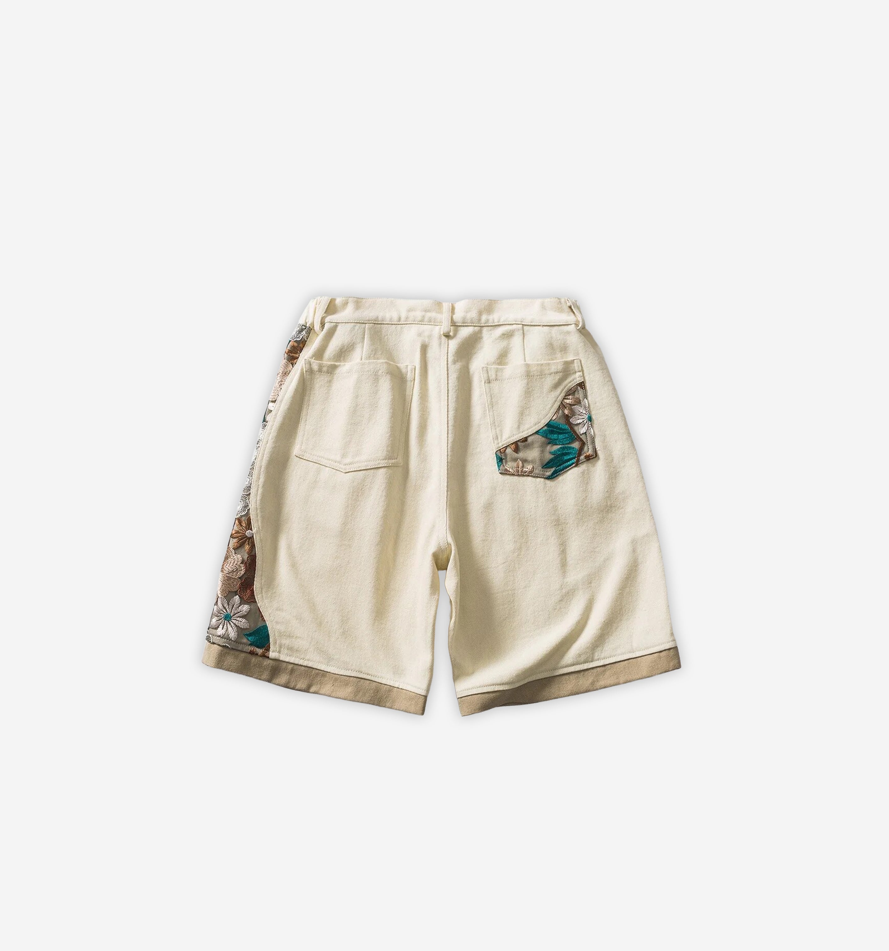 Colorful patchwork shorts by 2KWRLD featuring mixed fabric patterns and a relaxed fit, perfect for casual summer wear.