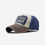 Red 2KWRLD racing trucker cap with front logo and mesh back for sporty, casual style.