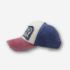 Red racing trucker cap by 2KWRLD featuring a curved brim and mesh back for sporty style and ventilation.