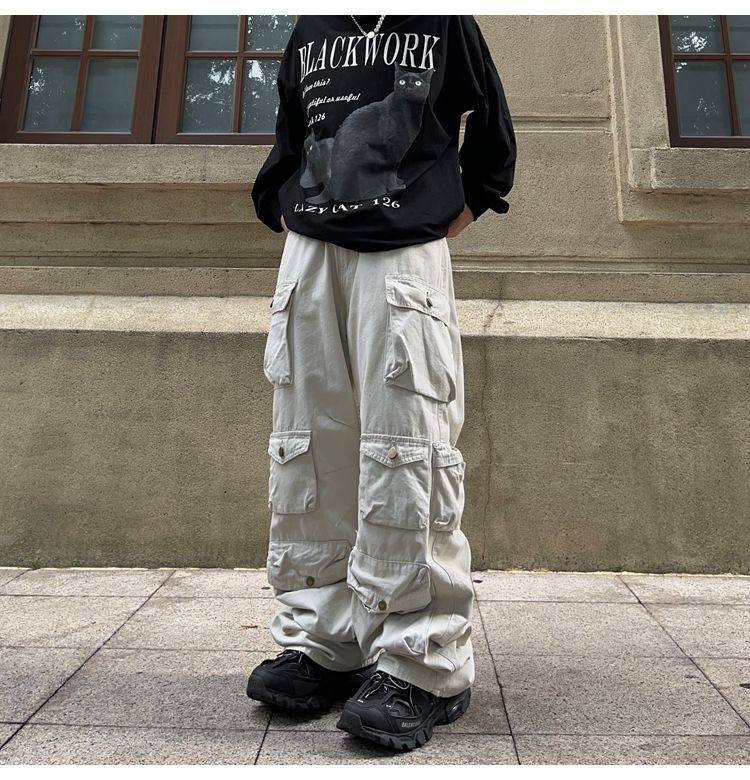 Black ten-pocket cargos by 2KWRLD with multiple utility pockets, made from durable fabric, versatile for casual and outdoor wear.
