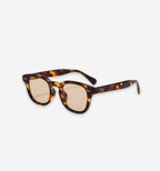 Calverton sunglasses by 2KWRLD featuring round frames, dark lenses, and sleek black design for stylish sun protection.