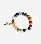 Wooden Temple bracelet by 2KWRLD featuring intricate carved design and adjustable cord for a stylish, natural accessory.