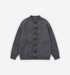 Dark gray Saturn Cardigan by 2KWRLD featuring a cozy knit texture and button-up front, displayed on a hanger.