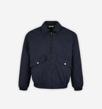 Reversible grid jacket by 2KWRLD featuring black and white checkered pattern, lightweight fabric, and modern casual style.