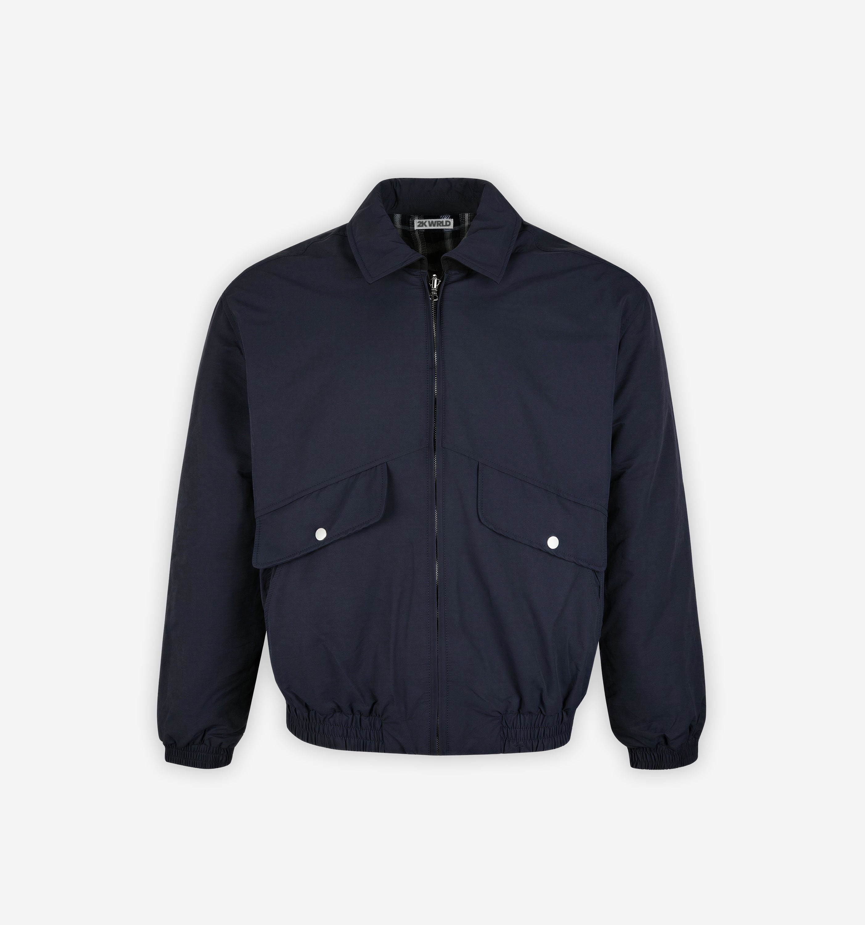 Reversible grid jacket by 2KWRLD featuring black and white checkered pattern, lightweight fabric, and modern casual style.