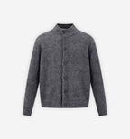 Melange knit cardigan by 2KWRLD featuring a cozy, textured fabric in neutral tones, displayed on a hanger.