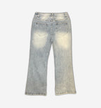 Light blue painted denim jeans from 2KWRLD, slim fit design, showing detailed painted patterns and distressed finish.