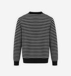 A striped waffle knit sweater from 2KWRLD featuring a cozy, textured fabric and a classic fit in neutral and bold stripe patterns.