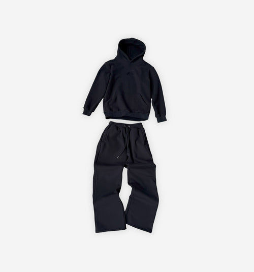 Black hoodie and pants set on a white background