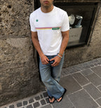 Black 2KWRLD Racer Tee displayed on a hanger, showcasing its classic fit and smooth fabric for casual streetwear style.