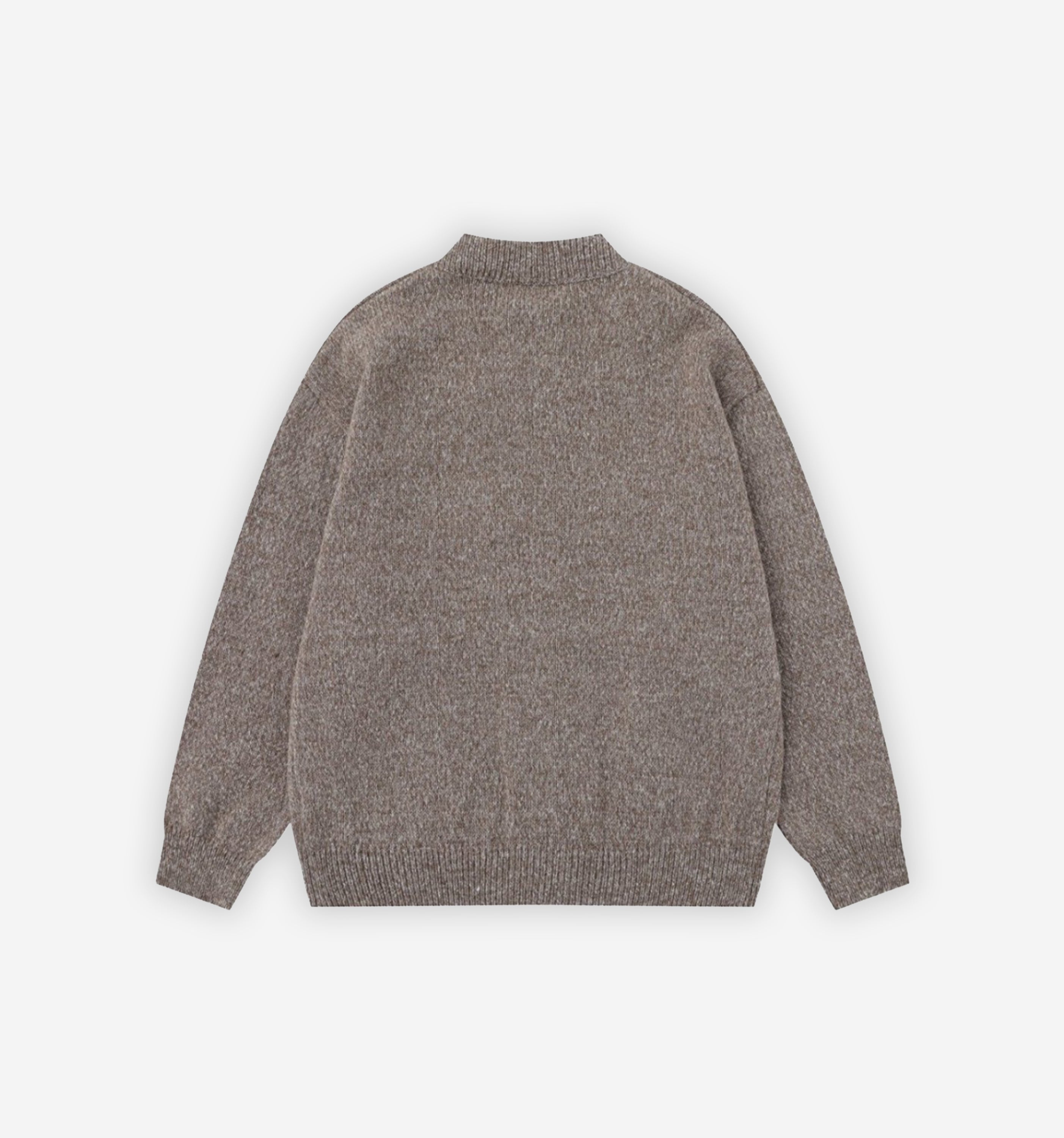 Saturn Cardigan by 2KWRLD displayed on a hanger, featuring a cozy knit fabric with a relaxed fit and button-up front design.