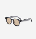Calverton sunglasses by 2KWRLD with round black frames and tinted lenses, stylish eyewear for UV protection and fashion.