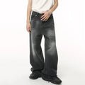 Black and grey Stellar Shadow denim jeans by 2KWRLD, showcasing a stylish slim-fit design with detailed stitching and modern look.