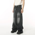 Black and grey Stellar Shadow Denim jeans by 2KWRLD, showcasing a stylish fit with shadowed denim fabric and subtle fading.