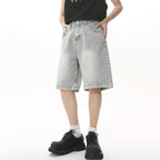 Blue Resist Jorts by 2KWRLD featuring distressed denim shorts with frayed hems and classic five-pocket design.
