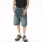 Blue Resist Jorts by 2KWRLD featuring distressed denim and a relaxed fit, perfect for casual summer wear.