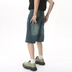 Blue Resist Jorts by 2KWRLD featuring distressed denim and rolled cuffs, casual fit perfect for summer and streetwear styles.