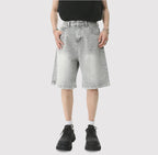 Blue Resist Jorts by 2KWRLD featuring distressed denim with a relaxed fit and frayed hem, stylish for casual summer wear.