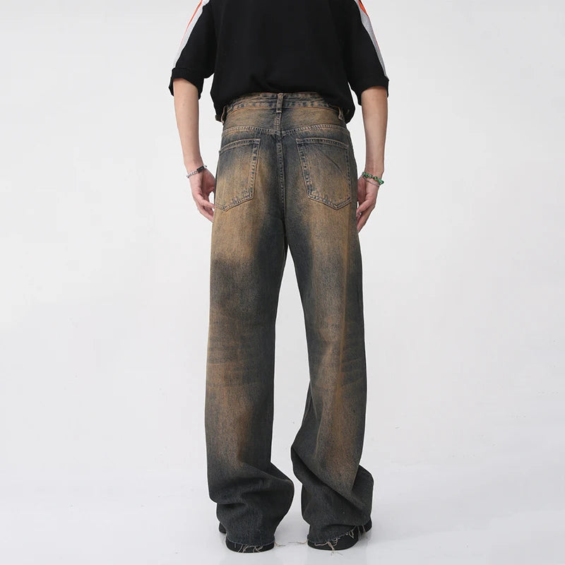 Blue Cosmic Dust Denim jeans by 2KWRLD with a cosmic-inspired design and classic denim texture.