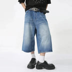 Blue Rebel Jorts by 2KWRLD featuring distressed denim shorts with frayed edges and a casual fit.