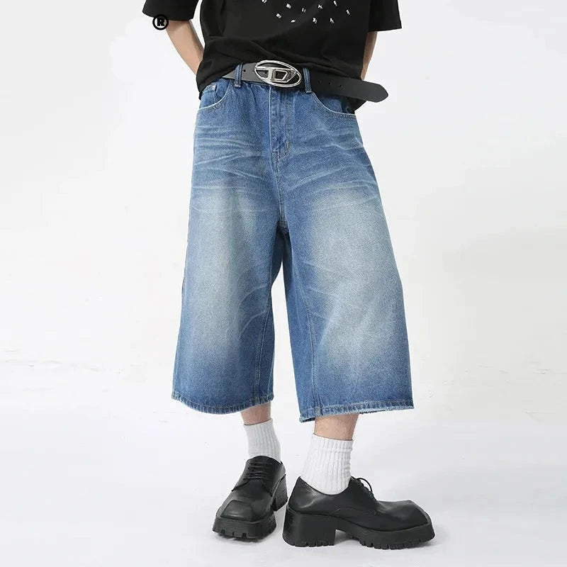 Blue Rebel Jorts by 2KWRLD featuring distressed denim shorts with frayed edges and a casual fit.