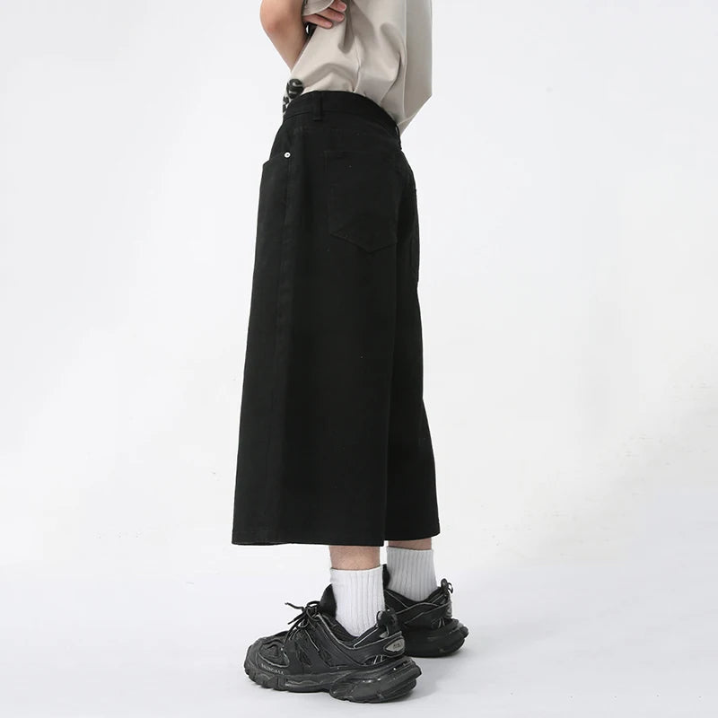 Blue Rebel Jorts by 2KWRLD featuring distressed denim shorts with frayed hems and a casual style.