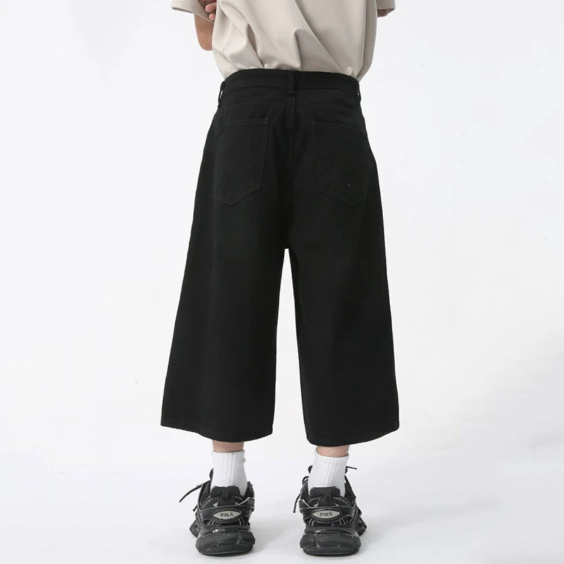 Blue Rebel Jorts by 2KWRLD, casual denim shorts with a distressed finish, featuring frayed hems and a relaxed fit.