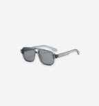 Akile Glasses by 2KWRLD featuring clear frames and stylish design, shown in the image with a modern, minimalist aesthetic.