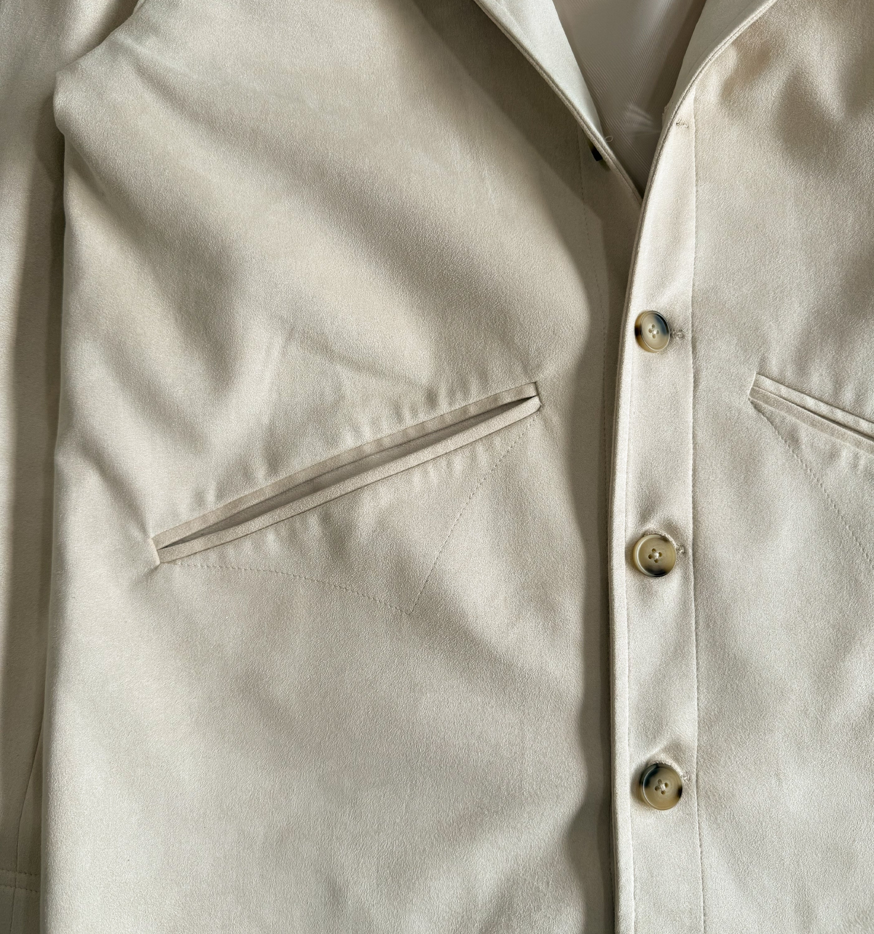 Front view of 2K WRLD Suede Jacket V2 showing front pockets and classic suede texture.