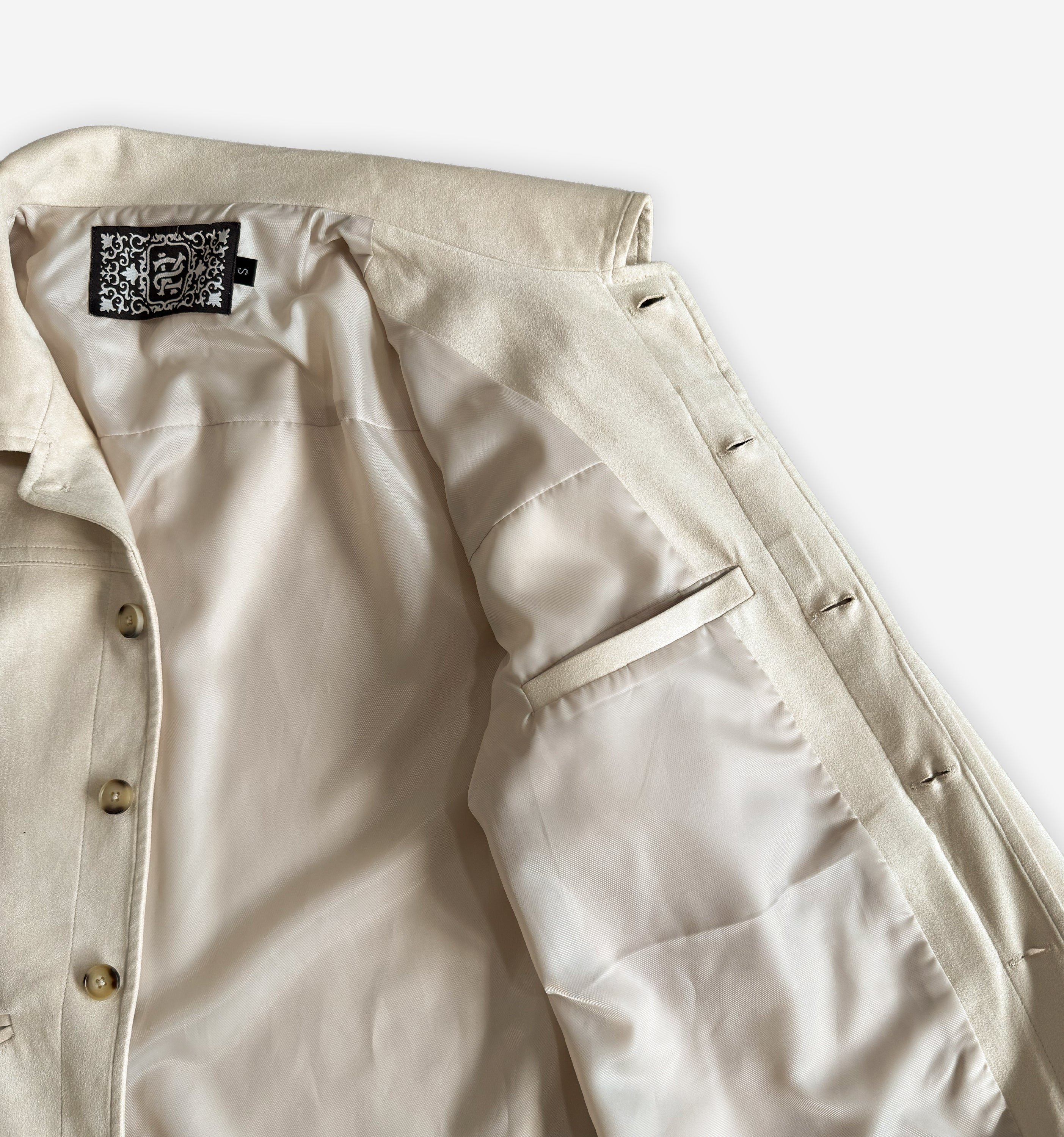 Inside view of the 2K WRLD suede jacket V2 showing the inner pocket and soft suede material.