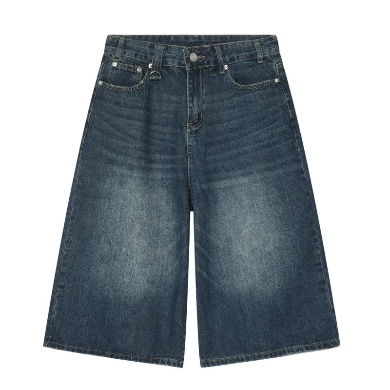 Light blue Revolt Jorts by 2KWRLD, showcasing distressed denim shorts with frayed hems and stylish fit.