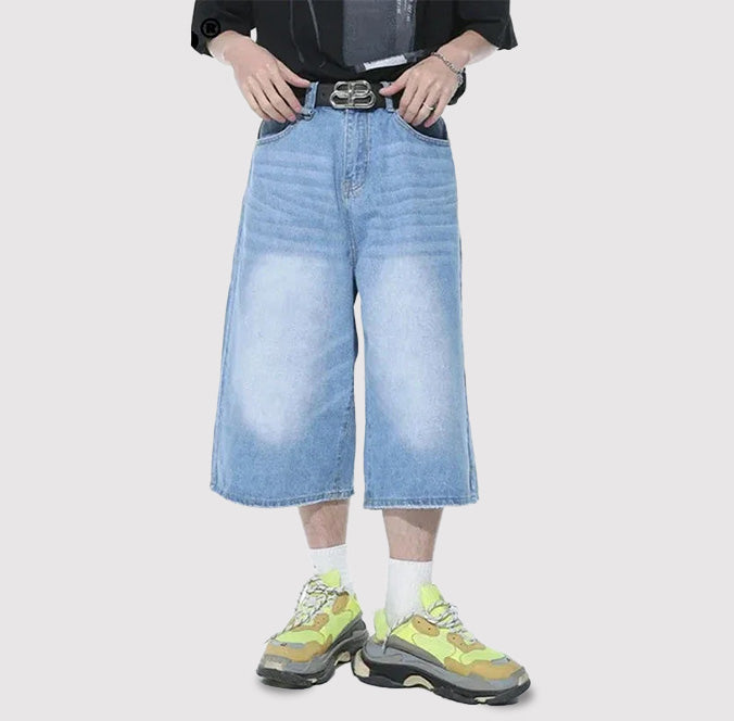 Light-blue Revolt Jorts by 2KWRLD, denim cut-off shorts with frayed hems, casual streetwear style.