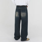 Azure denim jeans from 2KWRLD featuring a classic fit, five-pocket style, and light blue wash, shown on a model.