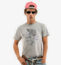 Model wearing a white Winged Horse T-Shirt by 2KWRLD featuring a graphic of a winged horse on the front.
