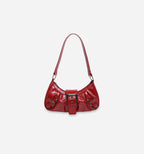 Red Nirvan shoulder bag by 2KWRLD featuring a sleek design, adjustable strap, and spacious interior for everyday use.