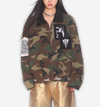 2KWRLD camo workwear jacket with durable fabric, multiple pockets, and a rugged military-inspired camouflage design.