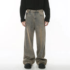 Light blue washed denim jeans from 2KWRLD's Concrete Jungle collection, showing a relaxed fit and distressed detailing.