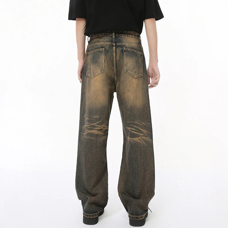 Pair of Desert Denim jeans by 2KWRLD featuring a classic fit, light wash, and casual style, displayed on a hanger.