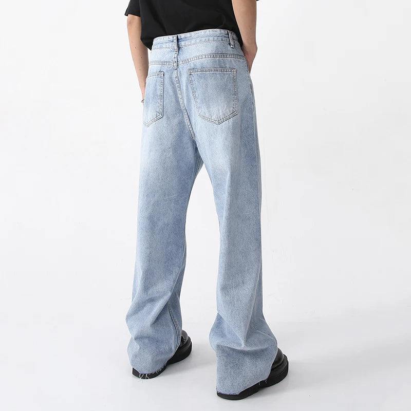 Light blue washed denim fabric from 2KWRLD showing soft, faded denim material with a textured, worn-in appearance.