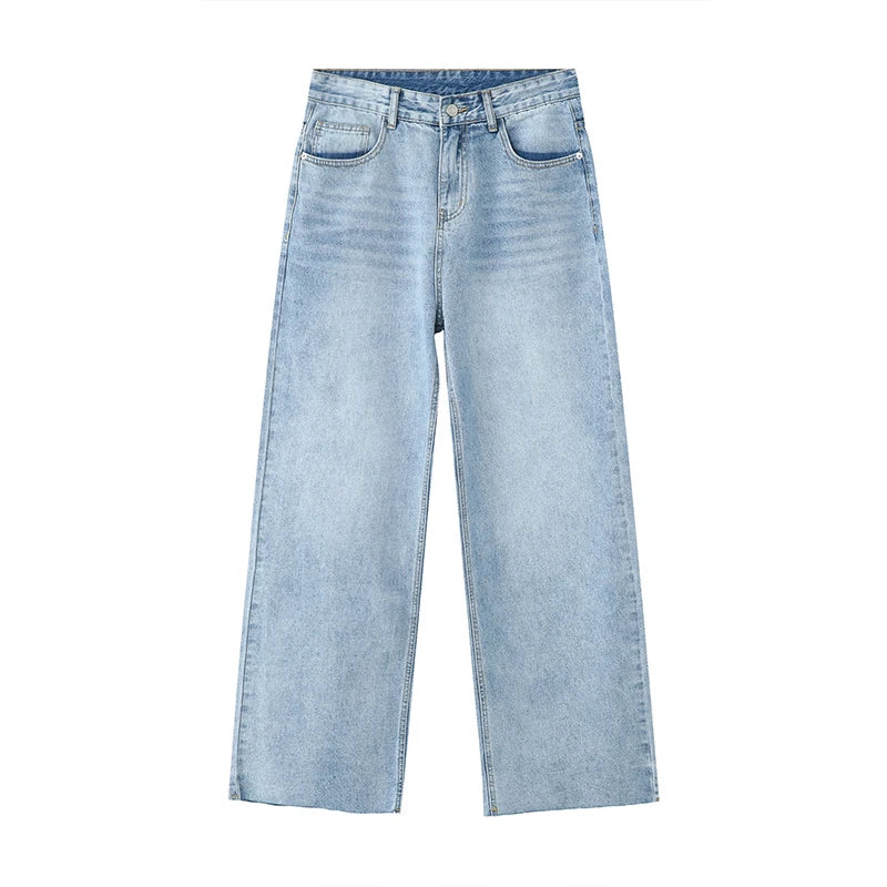 Light blue washed denim fabric from 2KWRLD, showing a close-up of the textured, faded denim material.